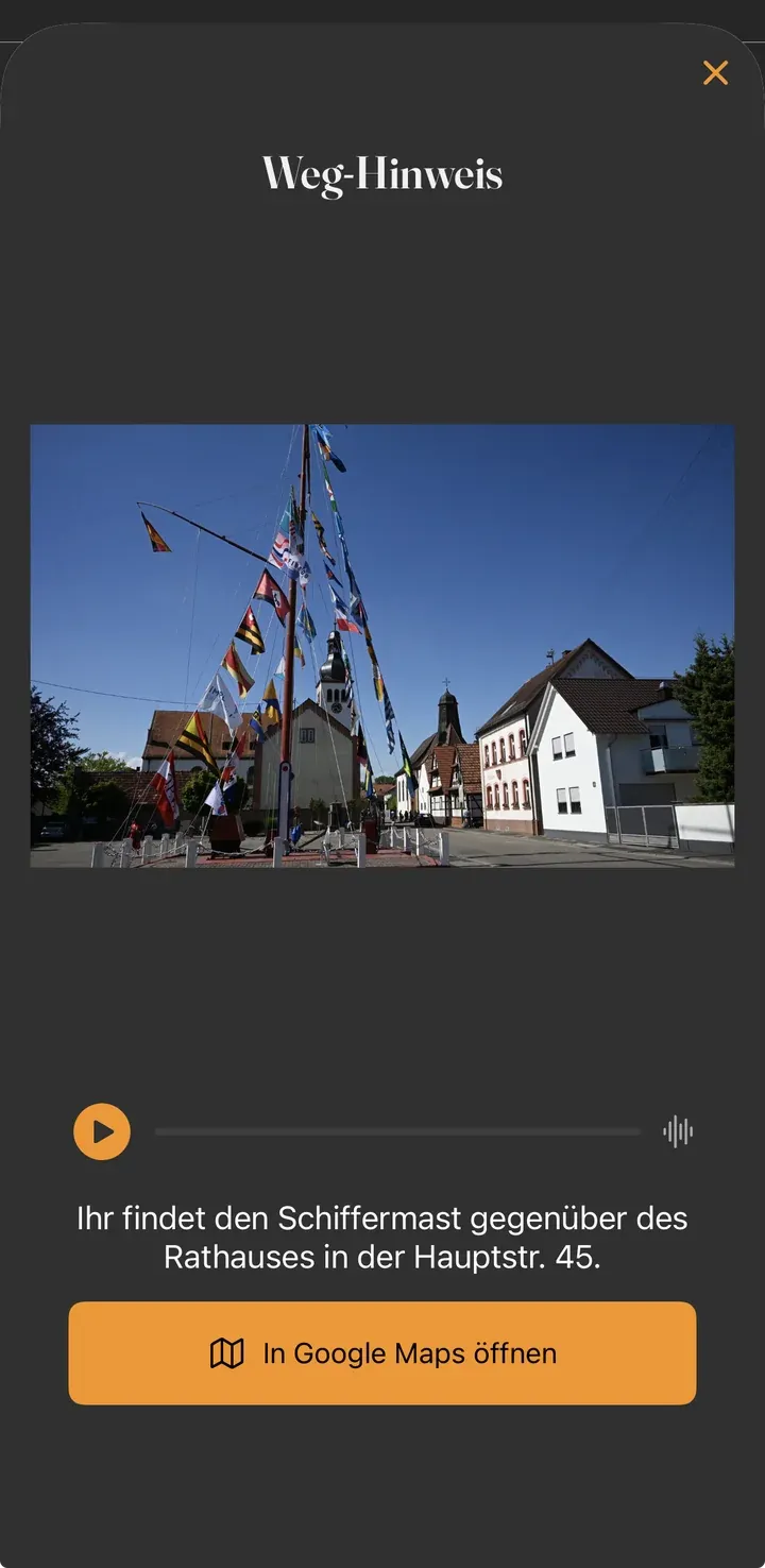 Weg-Hinweis-Popup mit Adresse „Ihr findet den Schiffermast gegenüber des Rathauses in der Hauptstr. 45“ und Button In Google Maps öffnen